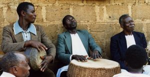 Evaristo Muyinda at home with friends, 1987